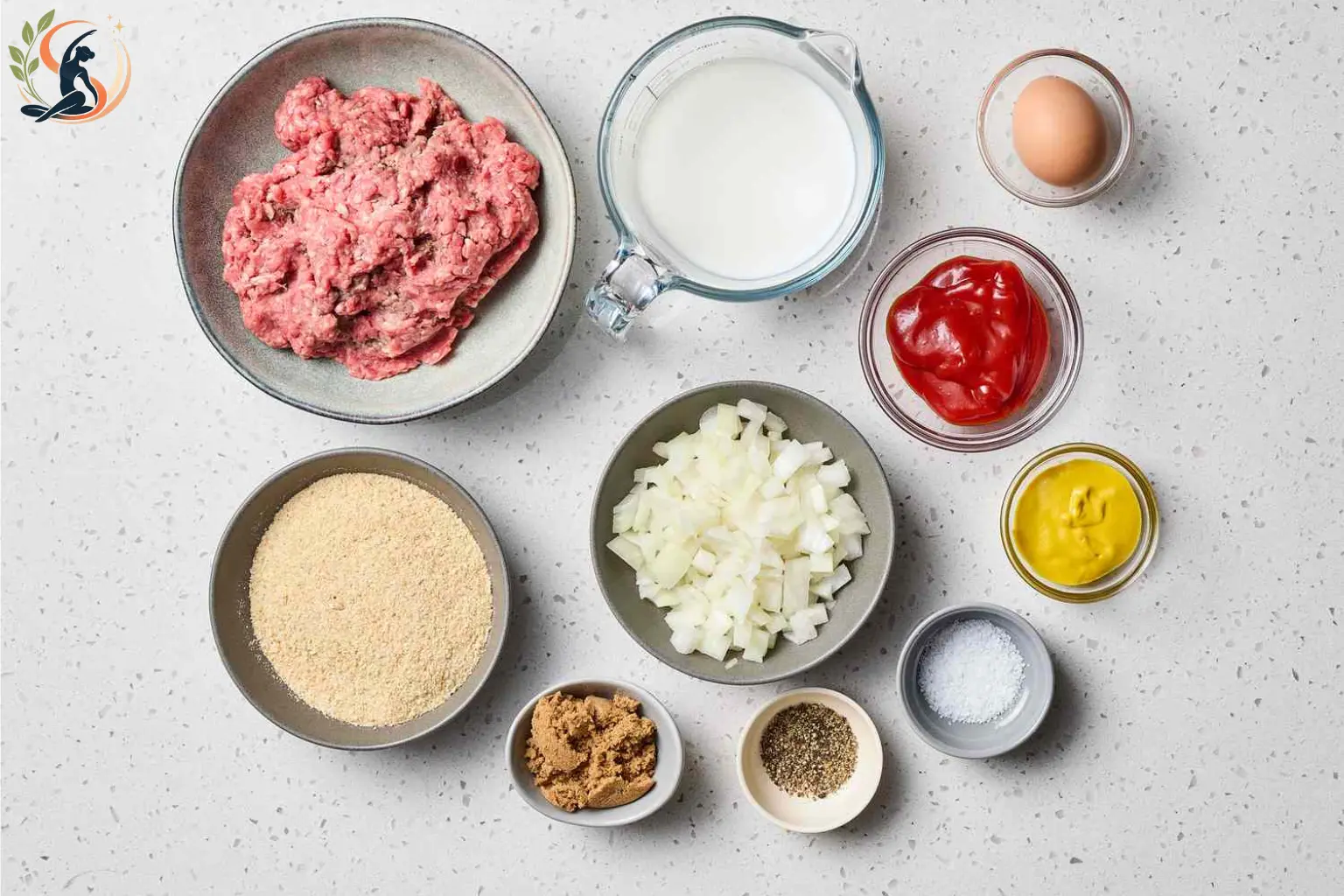Ingredients for a healthy meatloaf made with lean ground beef, oats, zucchini, egg and tomato sauce.