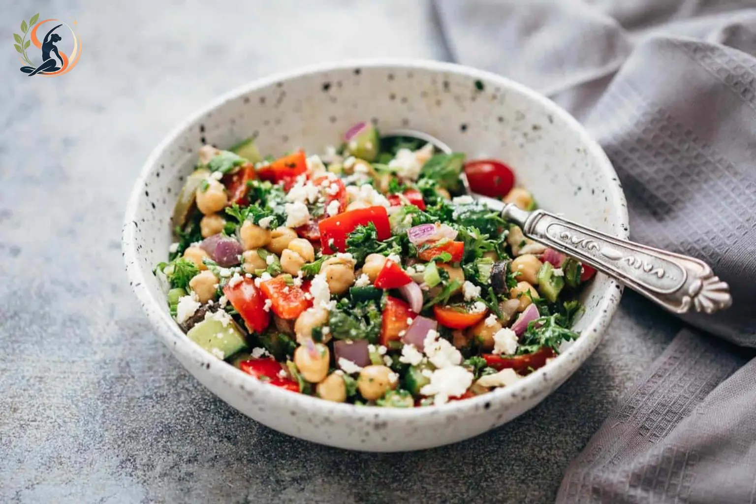 Mediterranean chickpea salad with cucumber tomatoes olives feta and red onion