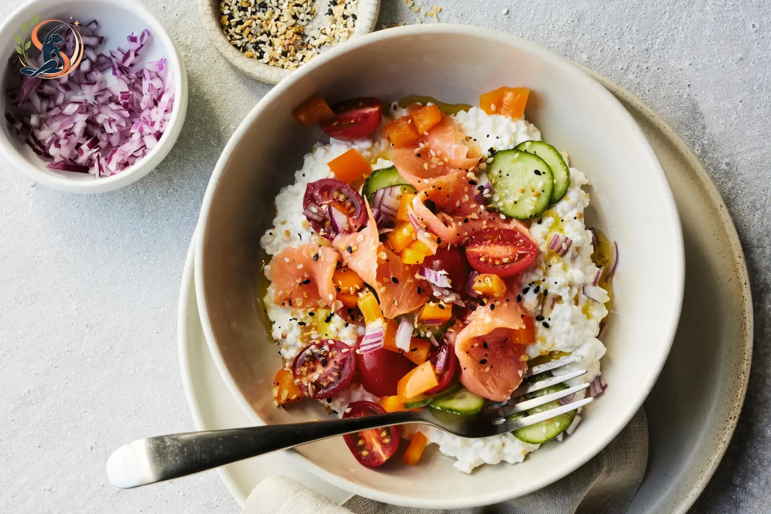 cottage cheese bowl with cherry tomatoes cucumber everything bagel seasoning and olive oil